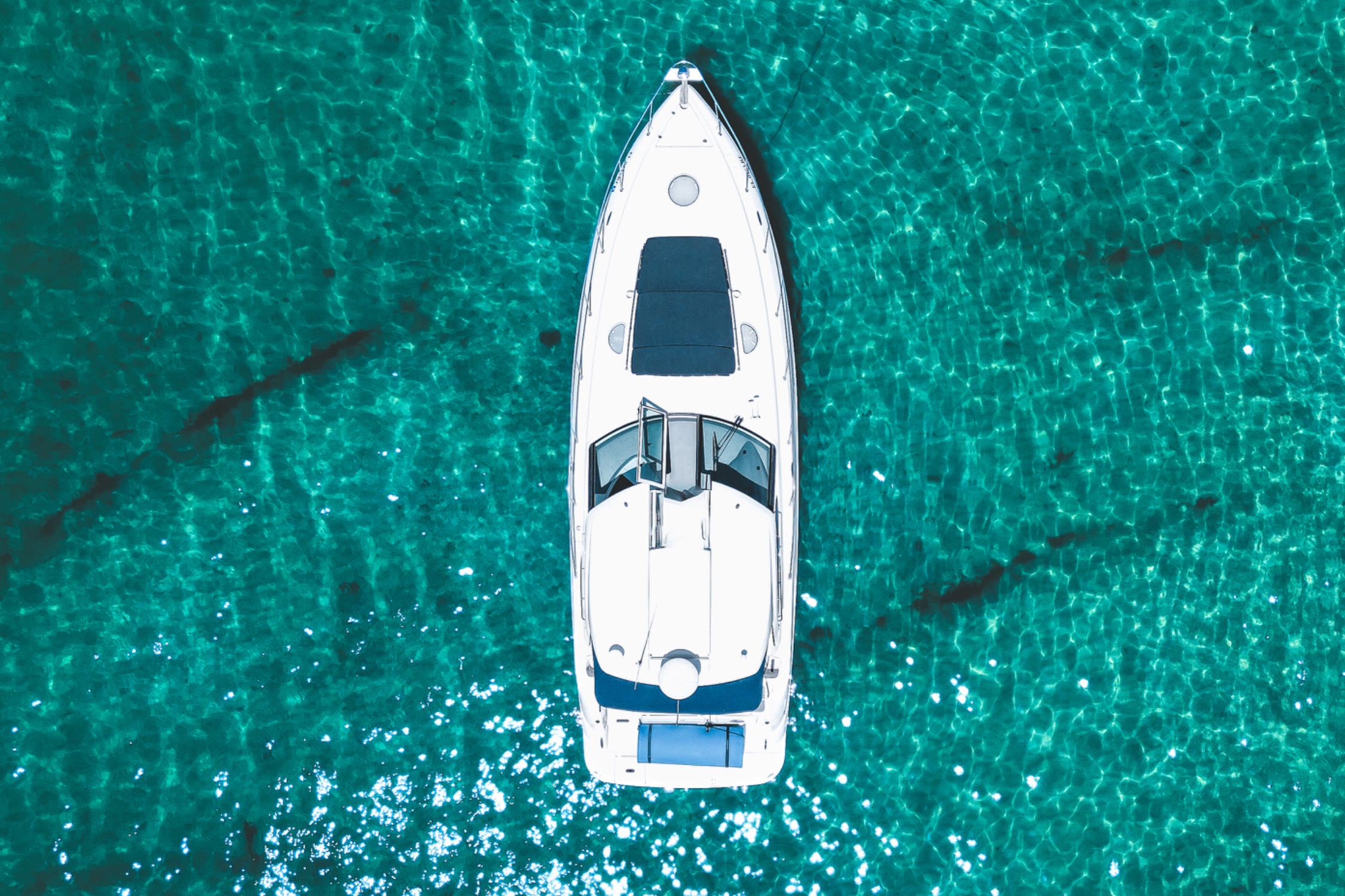 Infinity Getaway Charters yacht cruising the emerald water near Destin, FL