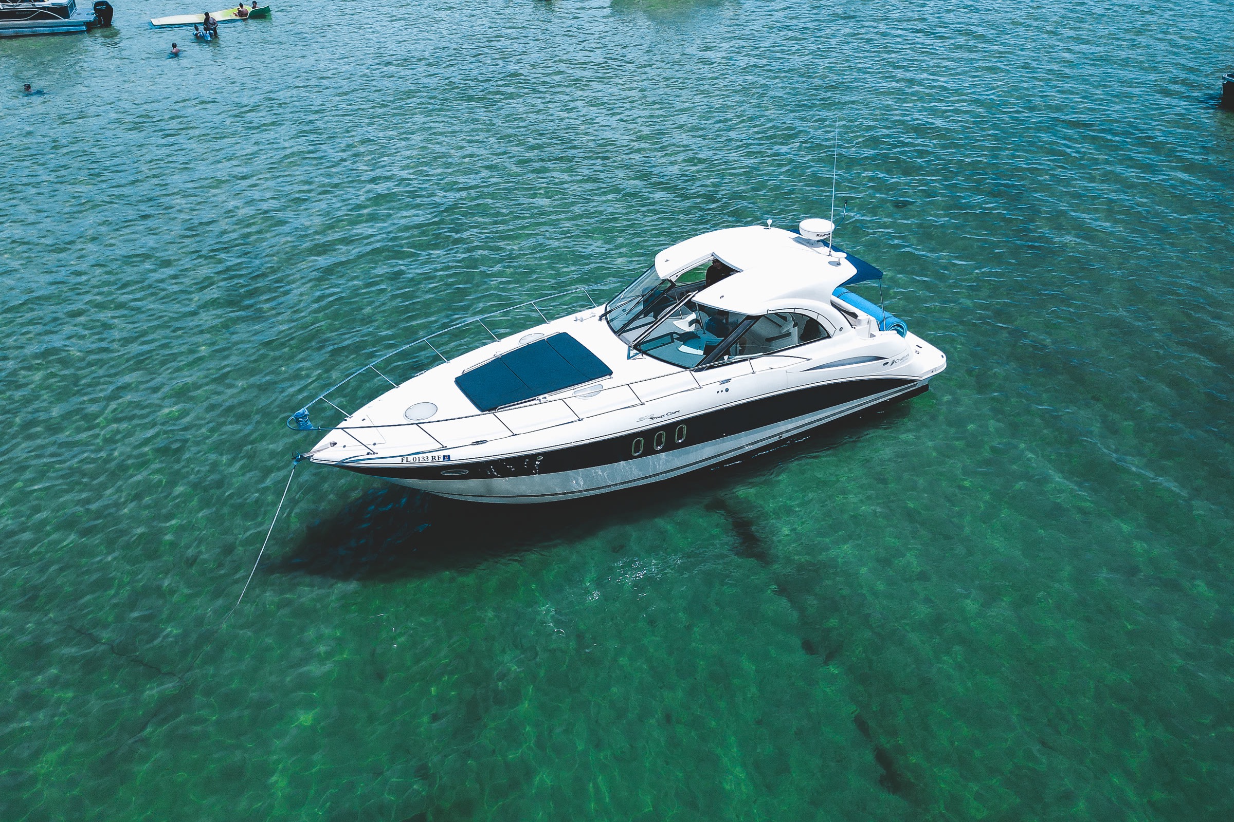 Infinity Getaway Charters yacht anchored at the Crab Island sandbar in Destin, FL