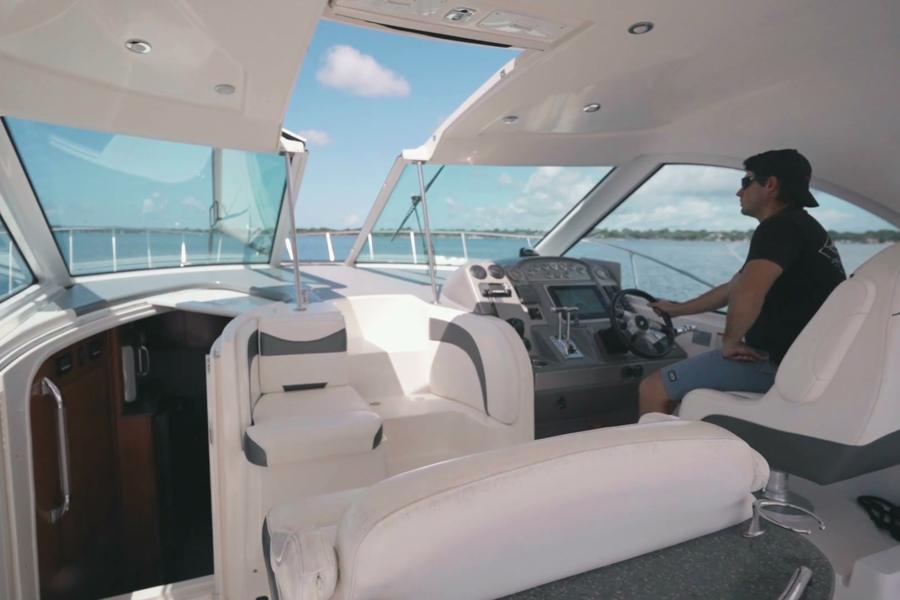 Captain Daryl Robinson at the helm of the Infinity Getaway Charters yacht underway